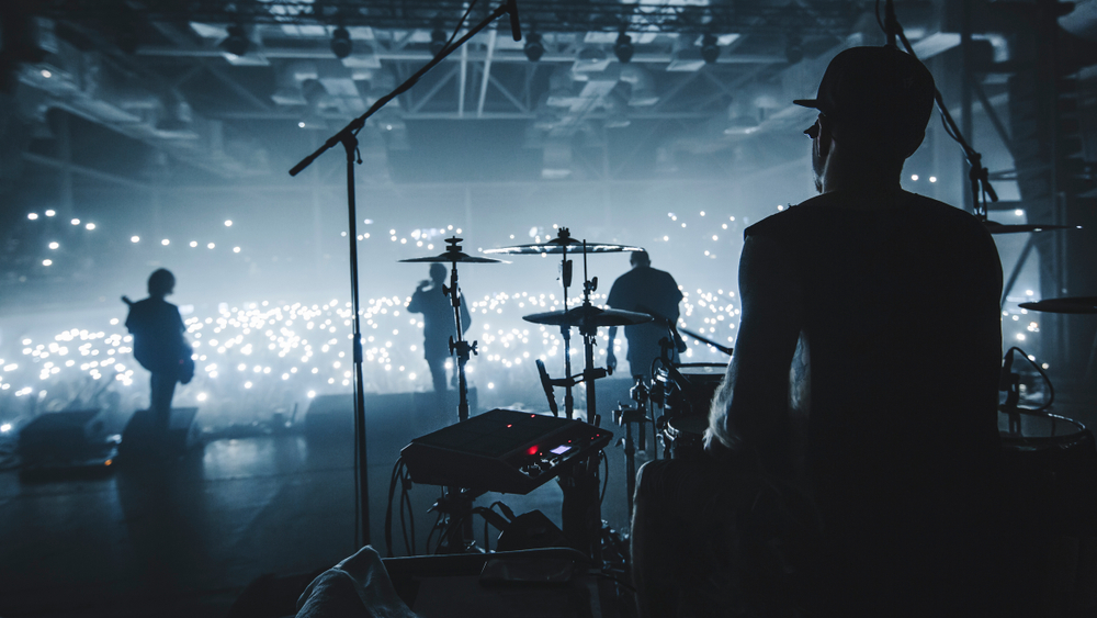 Silhouette of a band from backstage